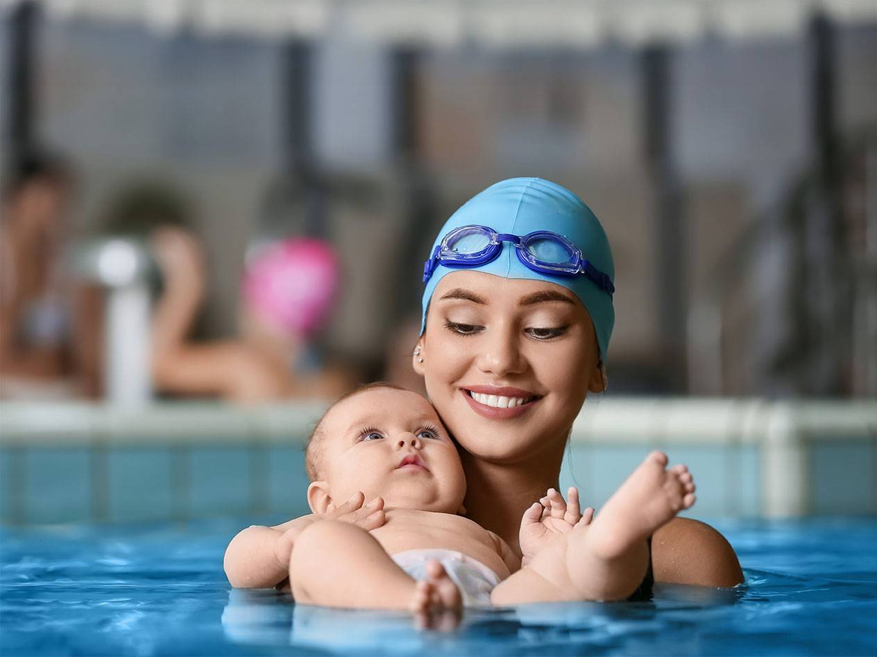 Mother and baby in a swimming pool.