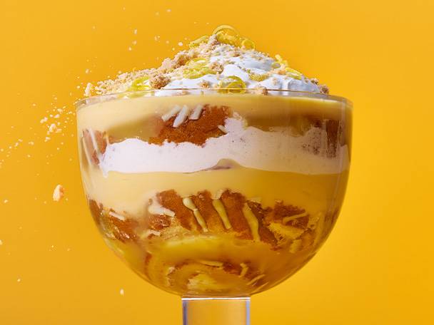 Lemon trifle with custard and biscuits.