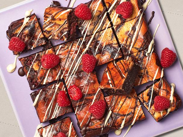 Chocolate brownies with raspberries and cream cheese.