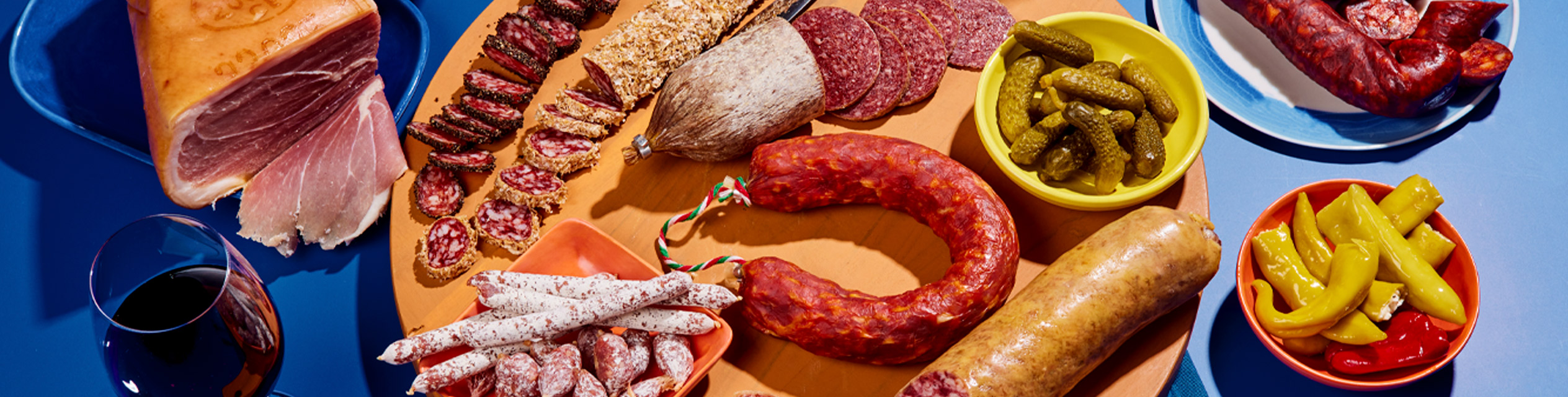 Iberian ham, salami, cheeses, and pickles.