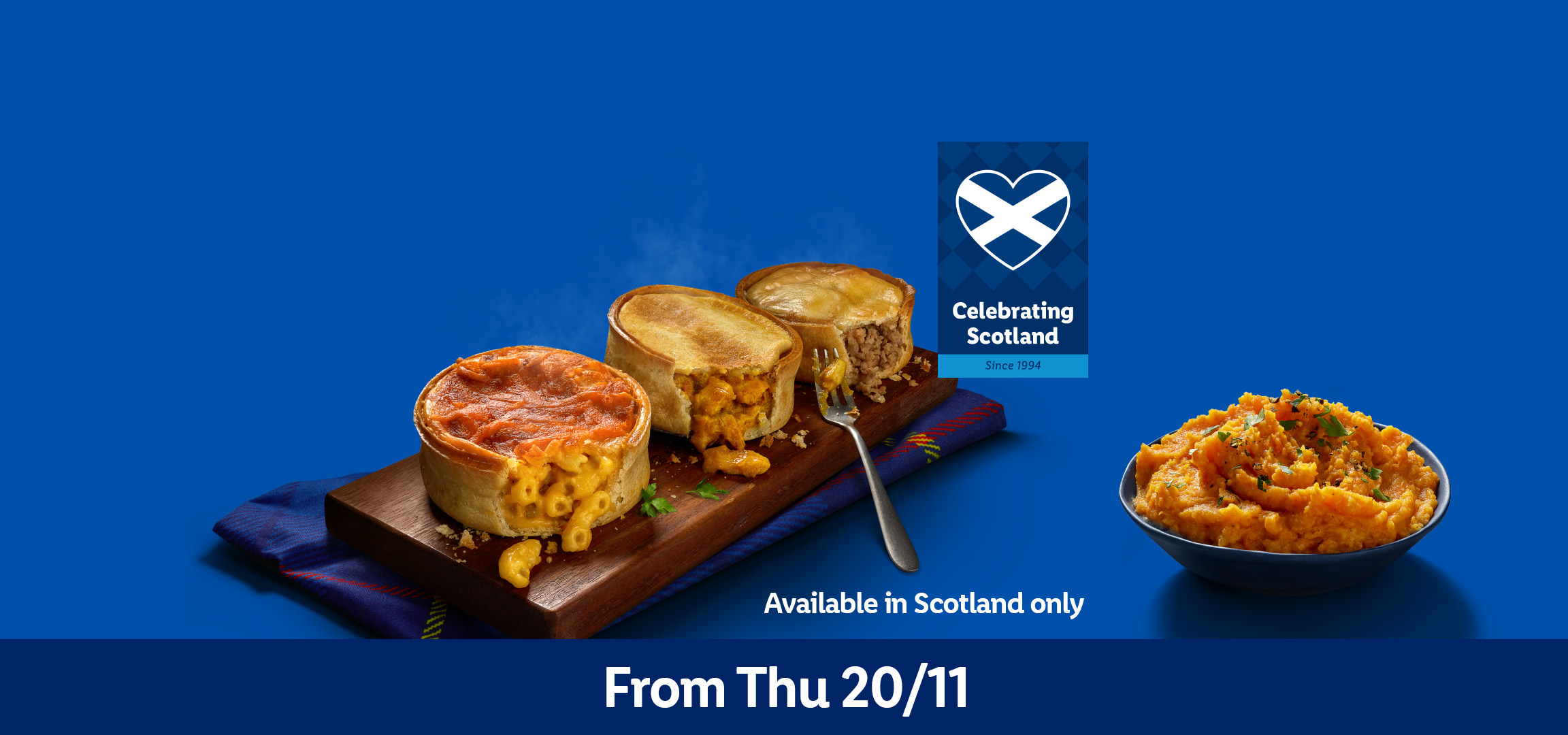 Pies with various fillings and a bowl of mashed vegetables, celebrating Scotland.