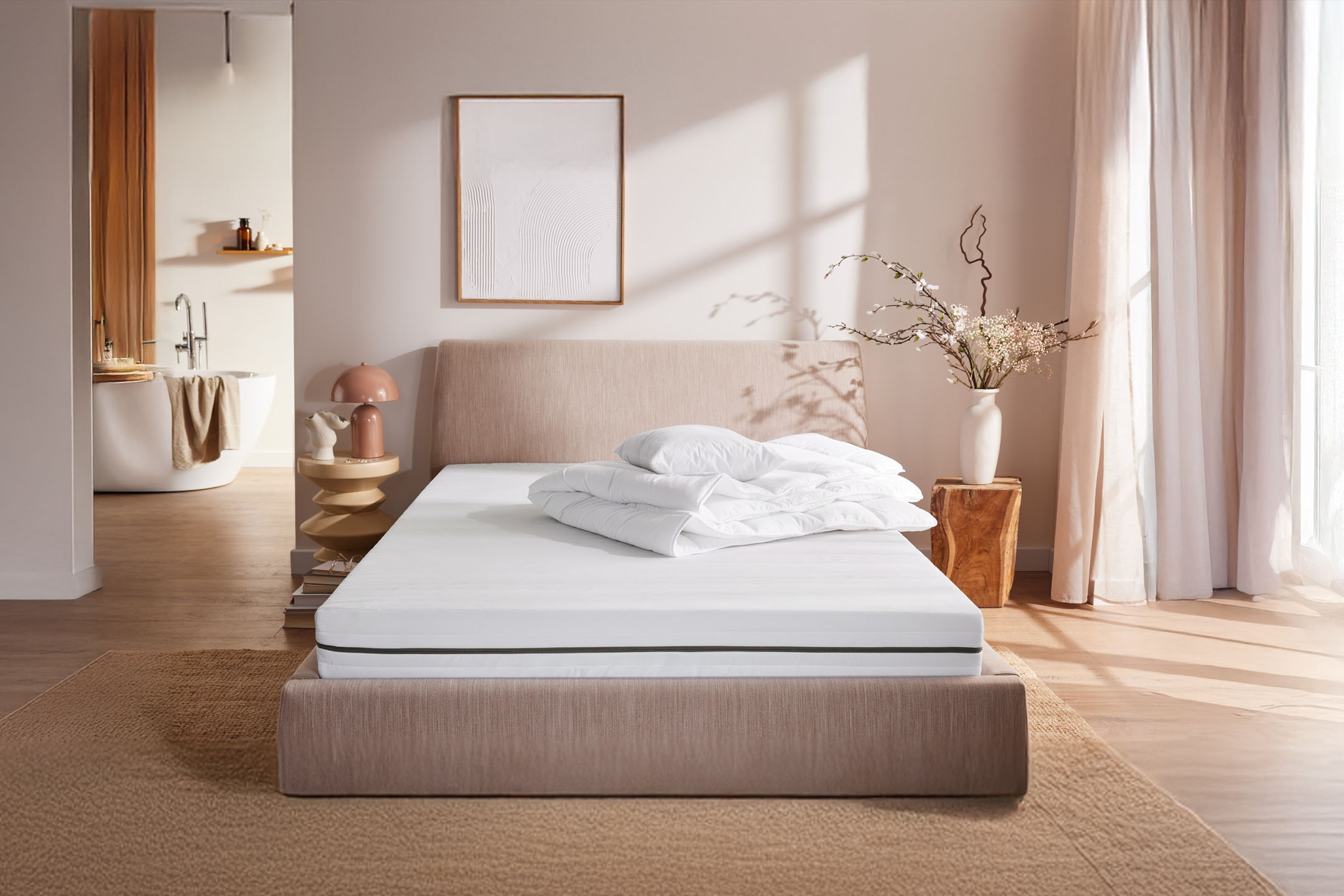Mattress and bedding in a minimalist bedroom.