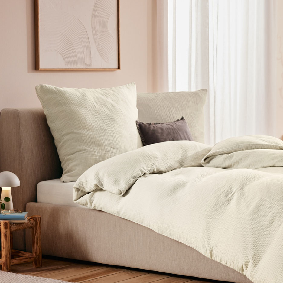 Light beige muslin bedding set.