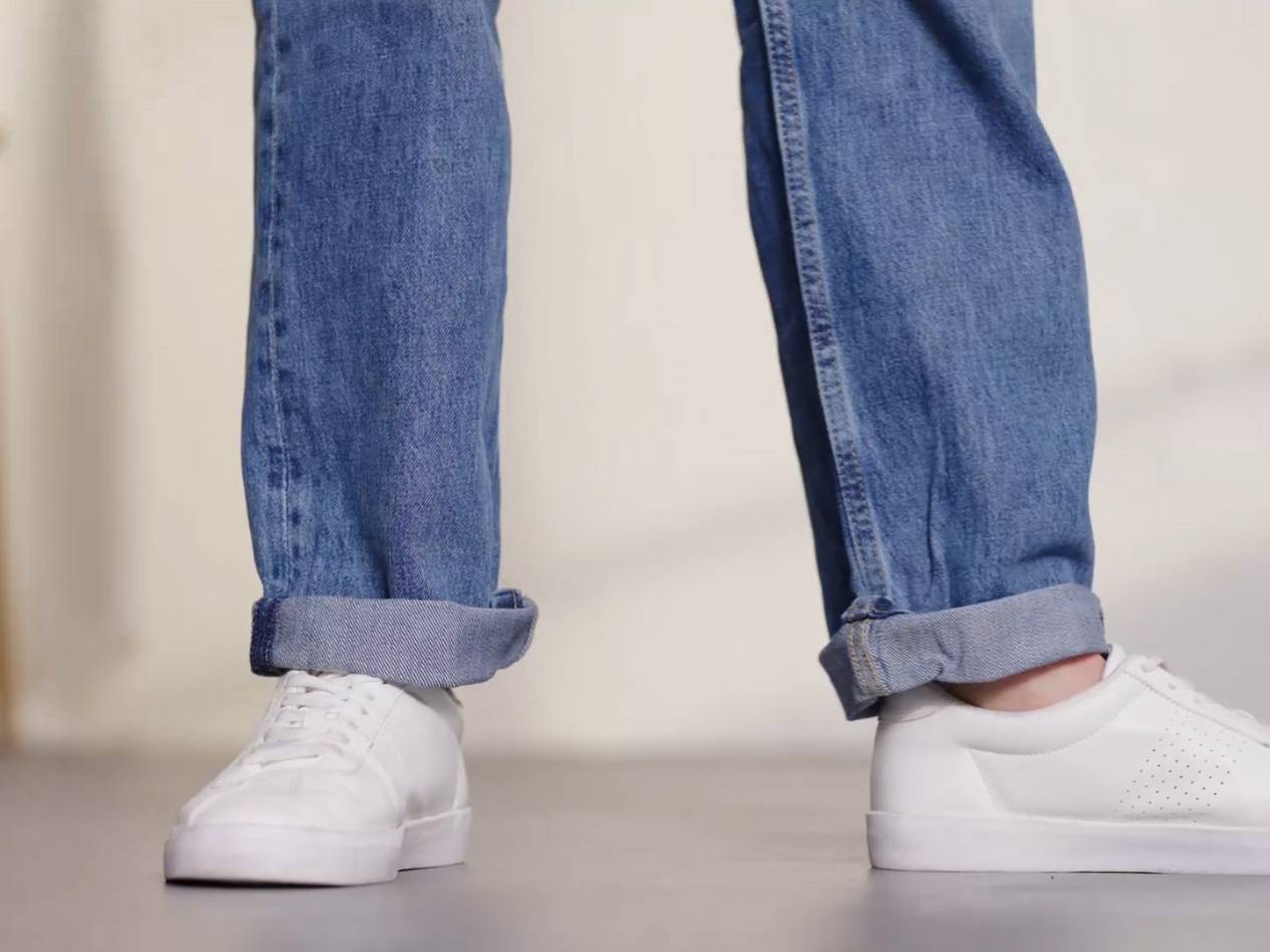 Jeans and white sneakers.
