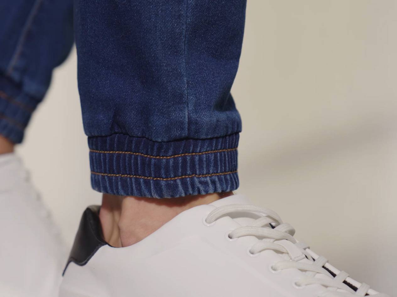 Jeans and white sneakers.