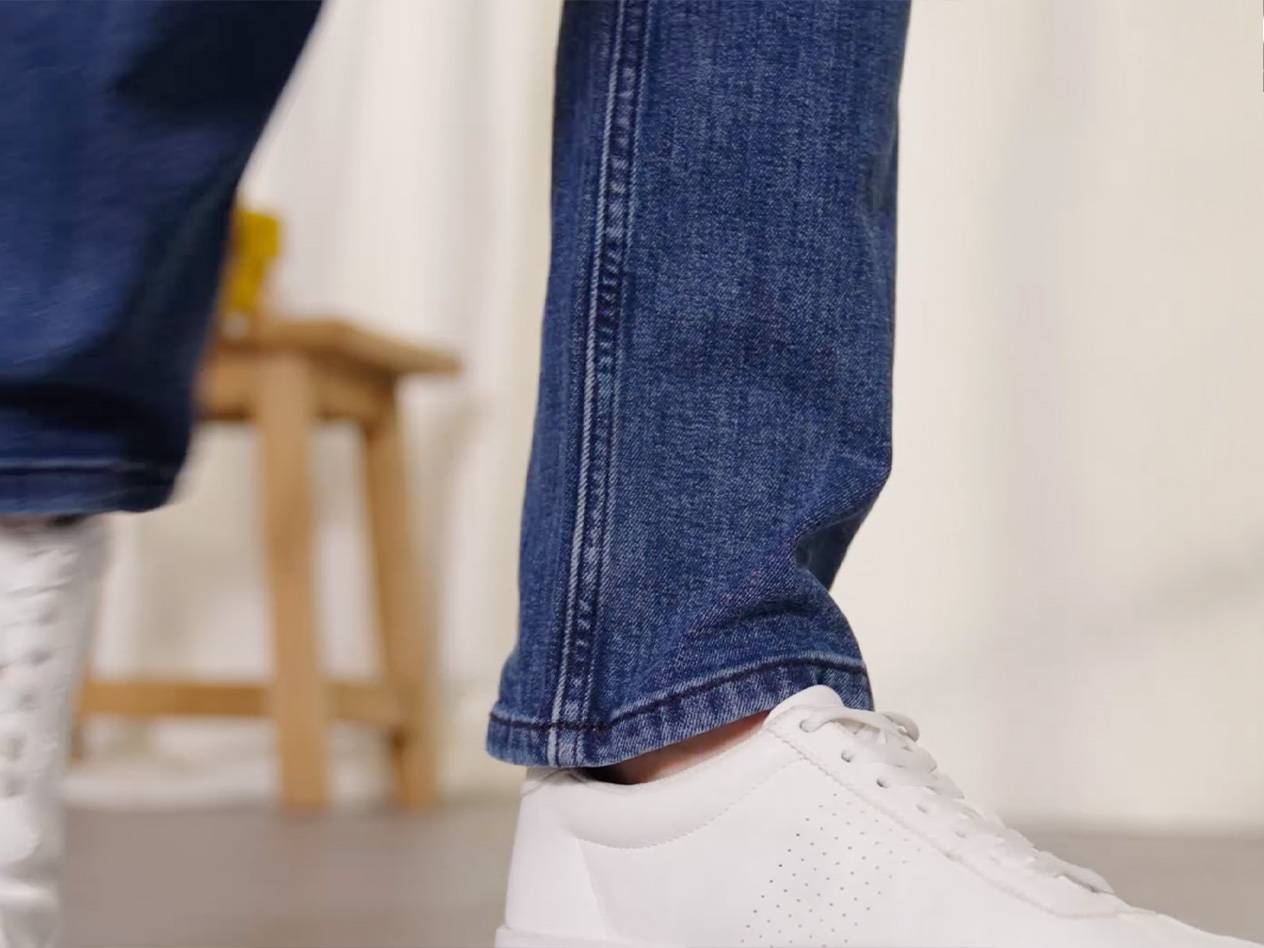 Jeans and white sneakers.