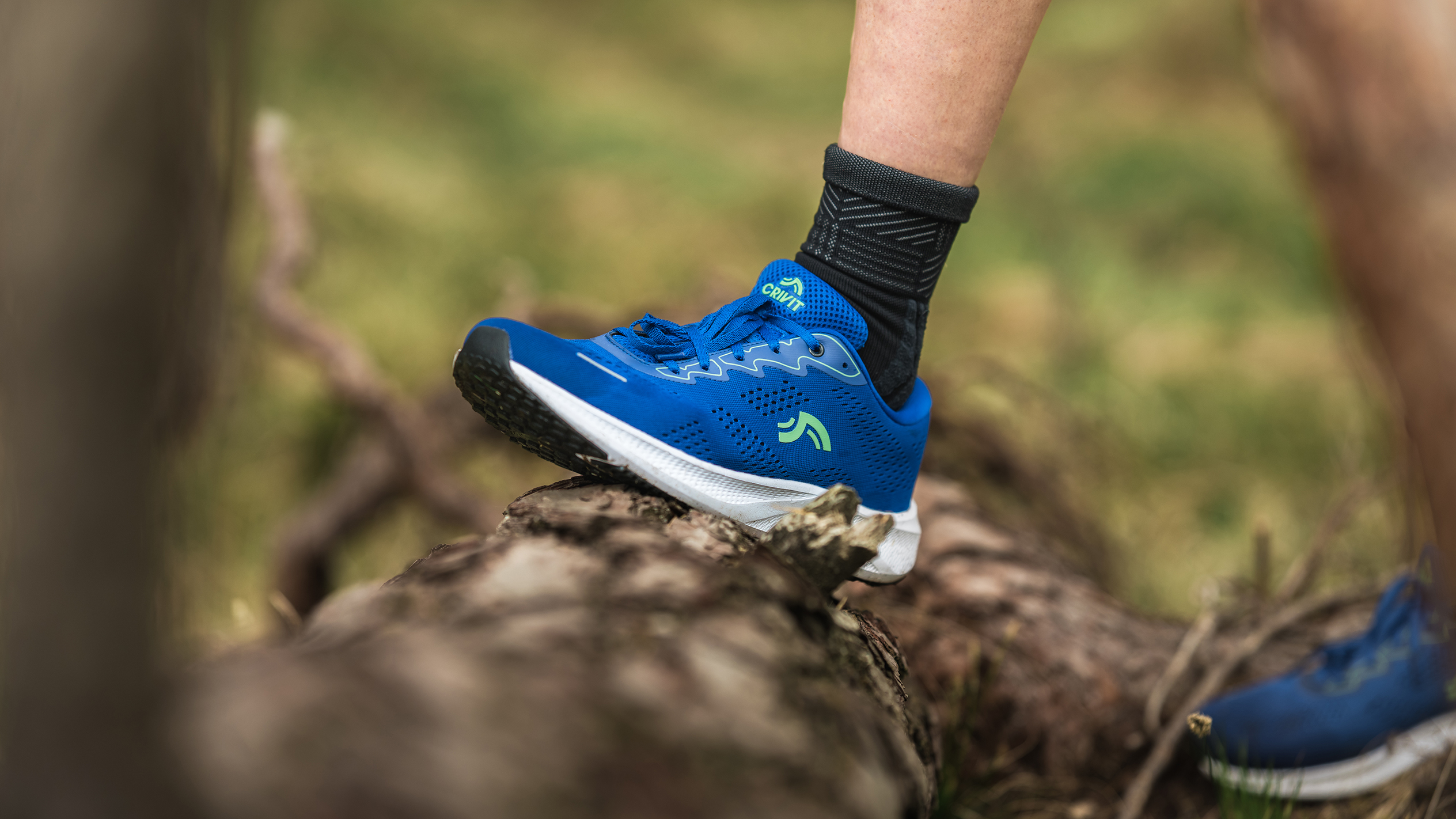 Crivit running shoes on a log.